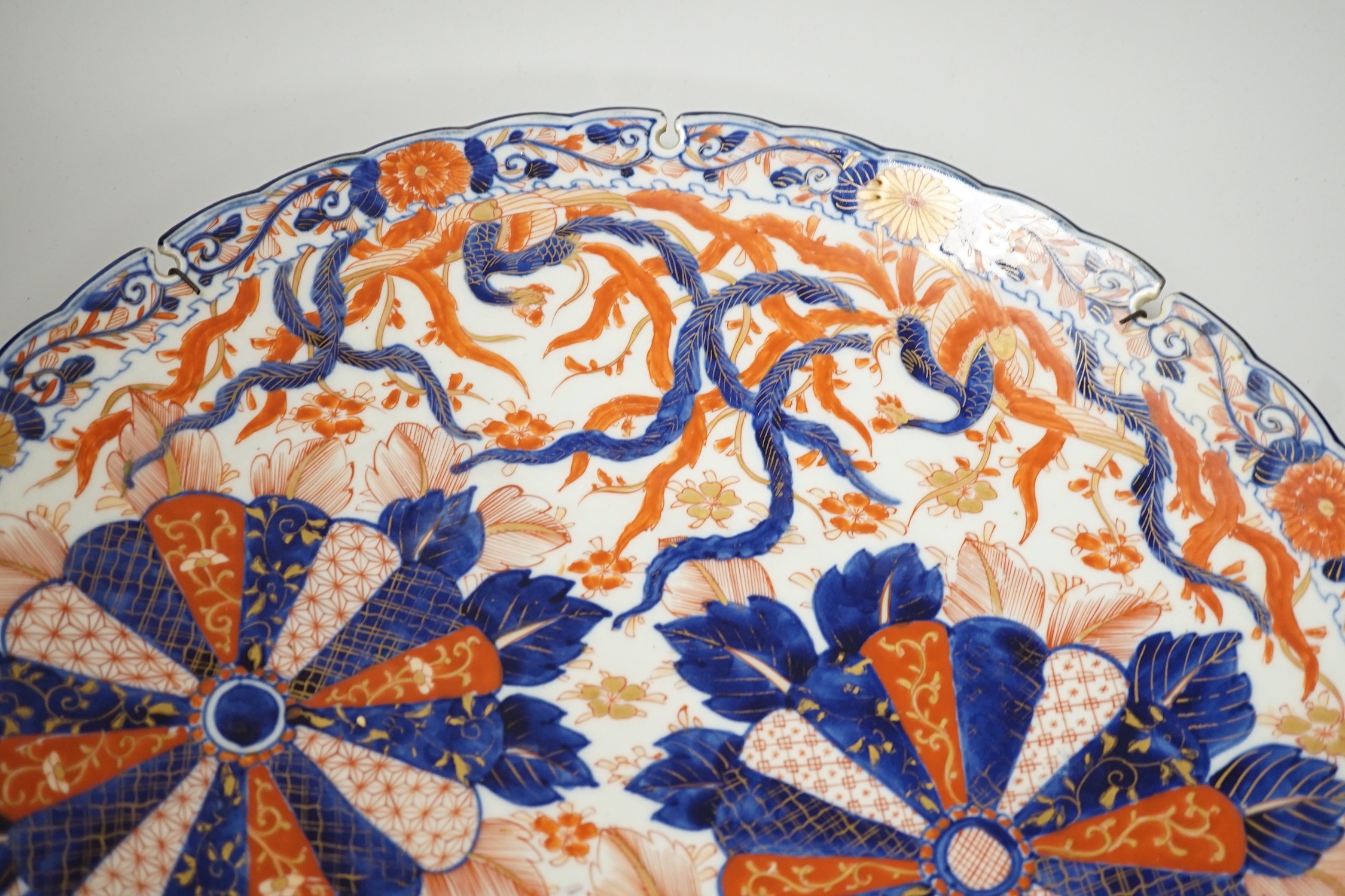 An Imari petal rimmed charger, in typical palette, Meiji period. 47cm